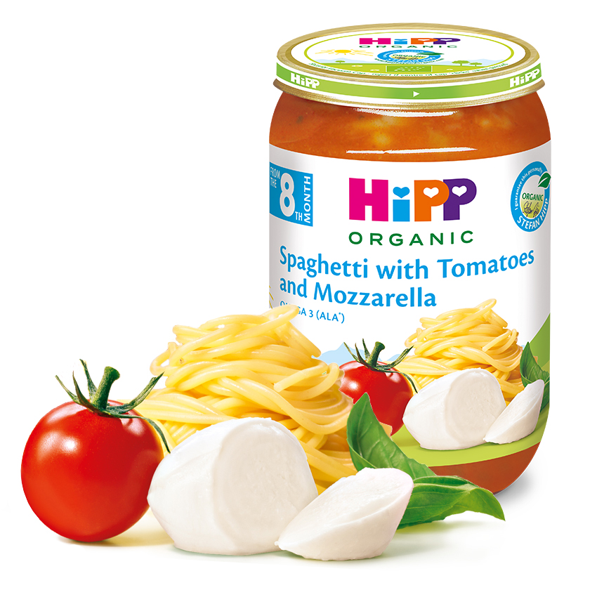 Mahepõllumajandusliku beebitoidupurgi, millel on silt "Spagetid tomatite ja mozzarellaga", on välja pandud koos tomati, mozzarella juustu ja basiilikulehega.